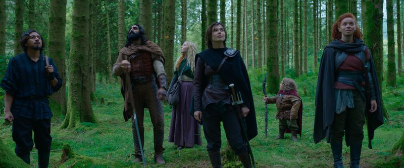 The cast of Willow on Disney+, kitted out in fantasy gear and standing in a forest, including Willow, Graydon, Boorman, Dove, Jade, and Kit.