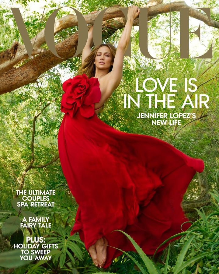 Lopez wears a Valentino Haute Couture dress in her December 2022 cover photo for Vogue. 