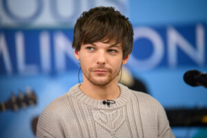 Louis Tomlinson on Saturday revealed he had broken his arm 'pretty badly'