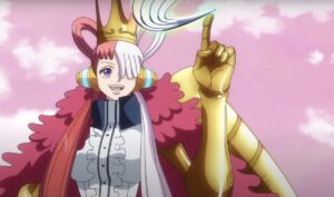 Uta, a woman with half-pink, half white hair, dressed in elaborate fluffy pink-and-white robes and gold arm gauntlets, draws a line in the air with one extended finger and leaves ribbon-like traceries hanging in space in One Piece Film: Red