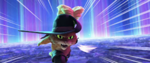 Puss in Boots, an animated orange tabby in boots and a swashbuckler hat, charges at the camera in a blur of motion lines against a stylized blue-and-purple background in the trailer for Puss in Boots: The Last Wish