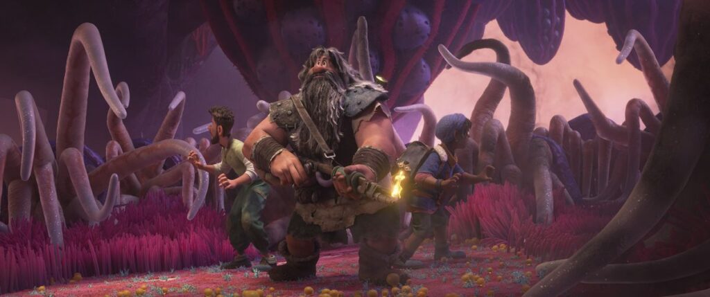 Three men —&nbsp;a bulky giant with a long gray beard and his much smaller adult son and teenage grandson —&nbsp;stand back to back in a pink-and-purple cavern full of strange grasses and tentacle-like growths in Disney Animation’s Strange World