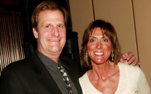 Jeff Daniels (L) in black suit standing next to Kathleen Treado, who is wearing an off-white sweater