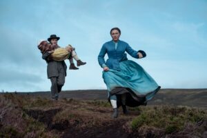 The Wonder. (L to R)  Kla Lord Cassidy as Anna ODonnell, Tom Burke as Will Byrne, Florence Pugh as Lib Wright in The Wonder. Cr. Aidan Monaghan/Netflix  2022