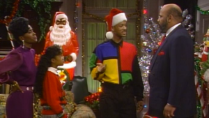 fresh prince deck the halls christmas episode will, ashley, aunt viv, and uncle phil stand in decorated living room