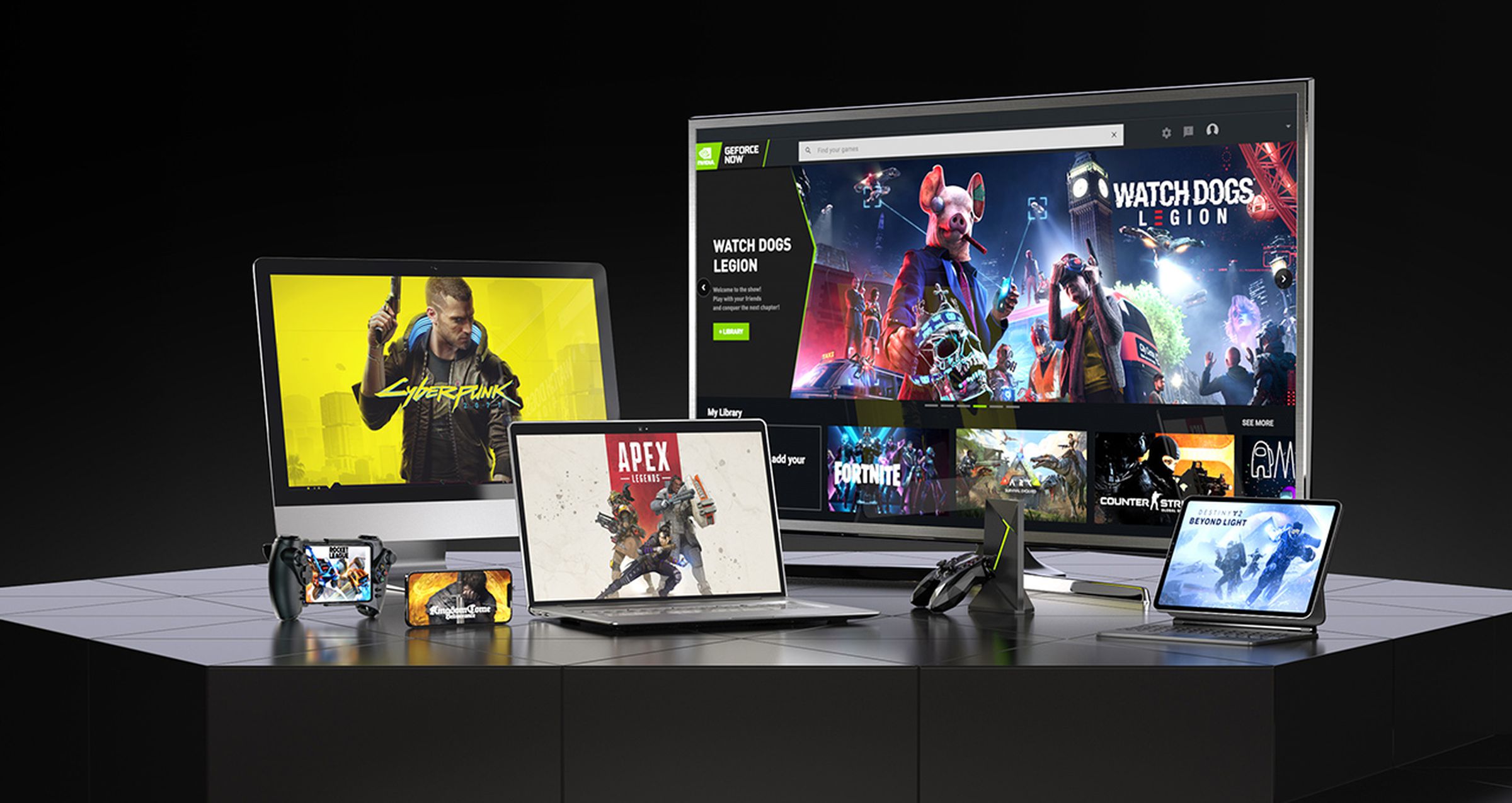 An array of devices on a table, all displaying the Nvidia GeForce Now streaming service.