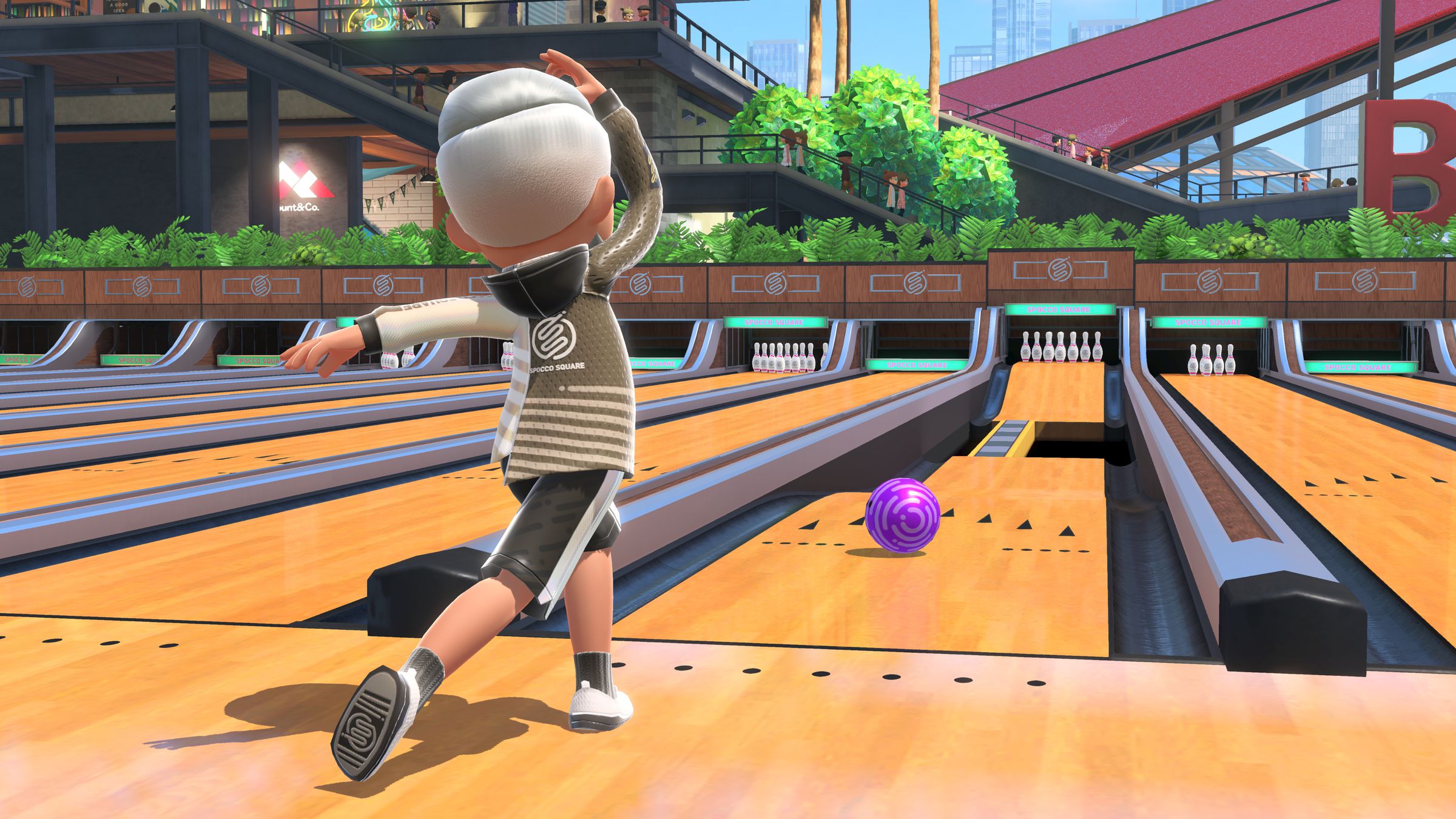 A person with white hair bowling.