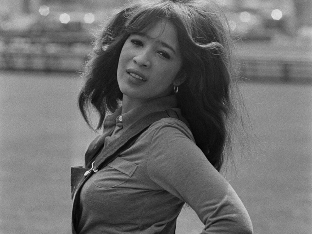 Black and white photo of Ronnie Spector turning to look at the camera in 1971