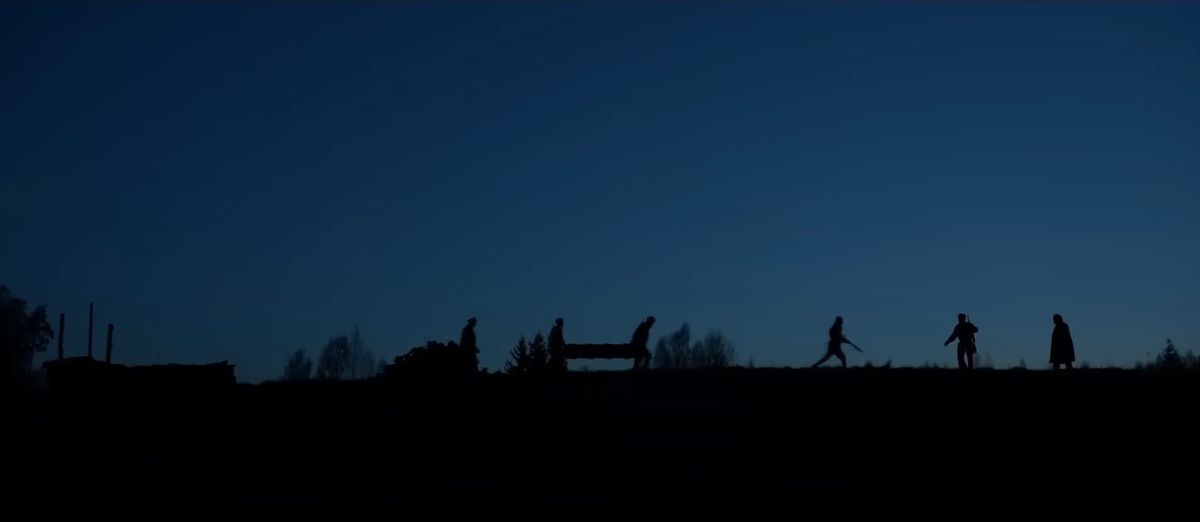 Soldiers are silhouetted against the night sky in Burial.