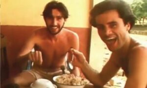 Journalists Tony Stewart (left) and Greg Shackleton enjoy a meal in Balibo hours before the village was attacked in October 1975.
