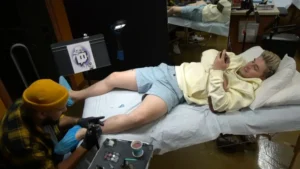 Ludwig gets Twitch logo tattoo after Valkyrae dare on charity stream