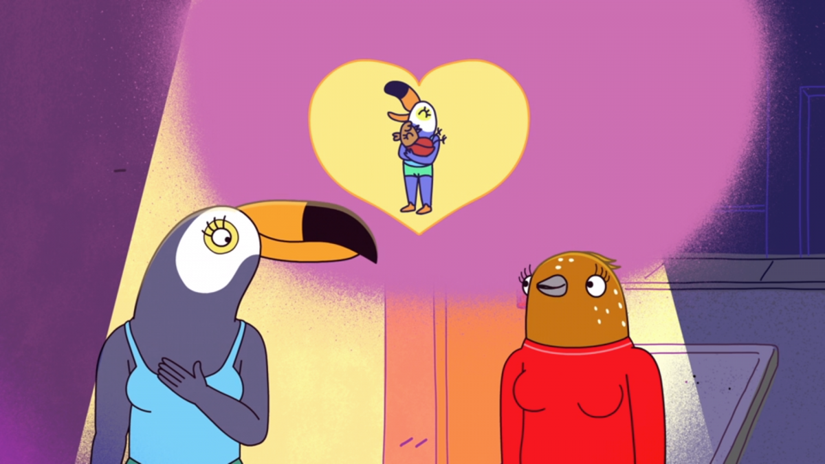 photo of tuca and bertie looking up at a heart image 