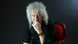 Queen Guitarist Knighted by King of England