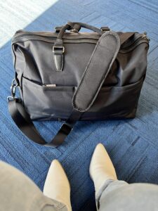 The Open Story Weekender Bag at the airport.