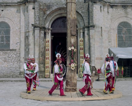 Voladores dance around the pole before climbing up and flying during the celebration of Semana Santa, Cuetzalan del Progreso