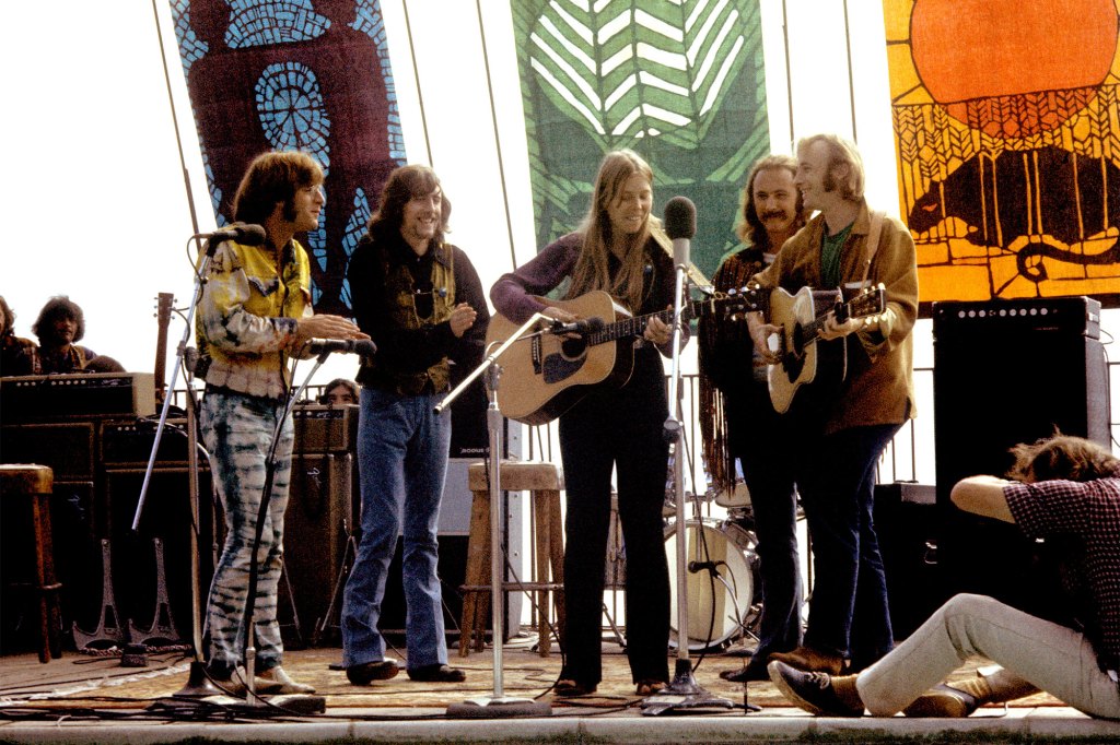 Joni Mitchell (center) performing with John Sebastian, Graham Nash, David Crosby and Stephen Stills at the Big Sur Folk Festival in 1969.