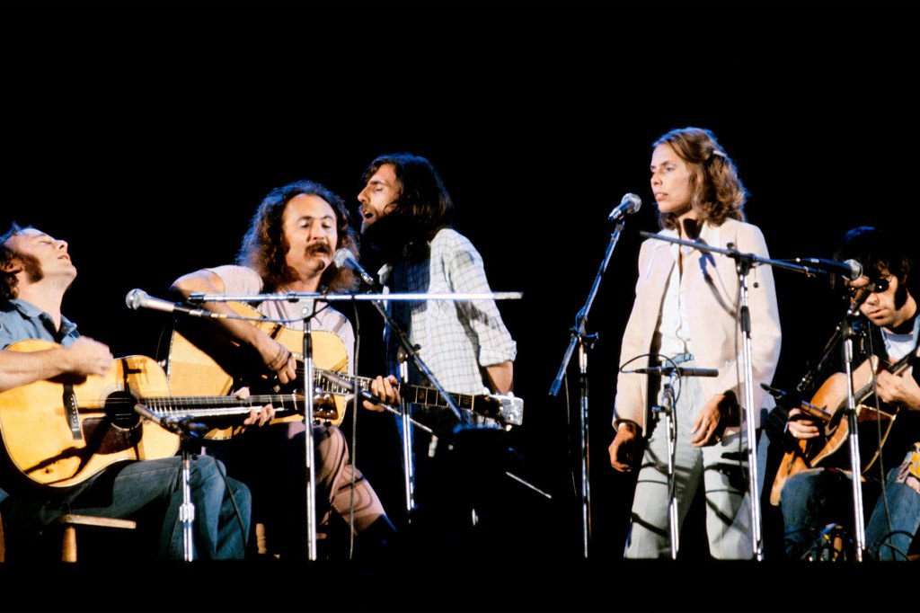 Stephen Stills (left), David Crosby, Graham Nash, Joni Mitchell and Neil Young, Joni Mitchell and Neil Young performing at London's Wembley Stadium in the '70s.