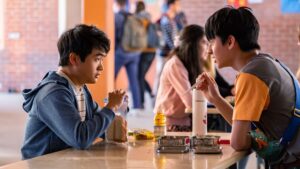 photo of two Asian american kids sitting at a lunch table in american born chinese