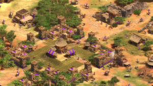 Screenshot from Age of Empires: II Definitive Edition featuring a small city fringed with purple banners