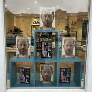 The window display at Bert's Books promoting the Duke of Sussex's memoir Spare next to author Bella Mackie's How to Kill Your Family.