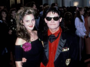 Drew Barrymore and Corey Feldman attend the 1989 Academy Awards.