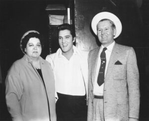 Rock and roll singer Elvis Presley with his parents Vernon and Gladys in 1961