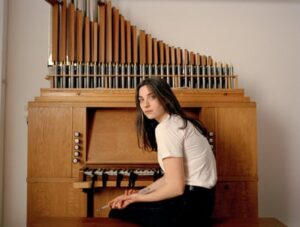 Kali Malone with a chamber pipe organ.