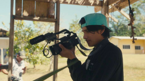 Bitaté with a video camera in 'The Territory'