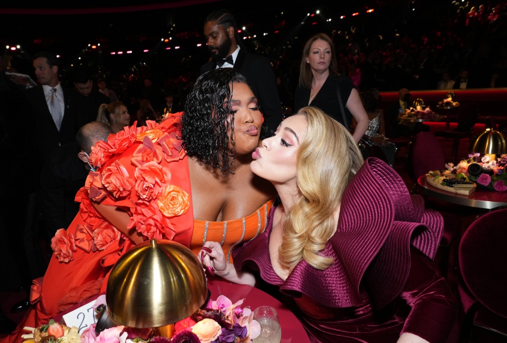 Lizzo and Adele are pictured at the Grammys. Video shows the pair were both thrilled for Styles' Grammy win.