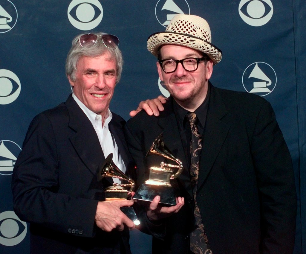 Burt Bacharach, left, and Elvis Costello hold their awards for best pop collaboration with vocals with "I Still Have That Other Girl" during the 41st Annual Grammy Awards in Los Angeles on Feb. 24, 1999.