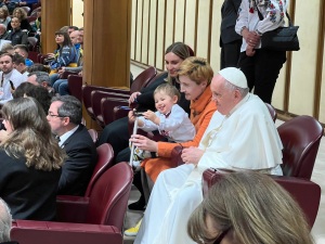 Toddler Sviatoslav plays with the pope's cane before a screening of 'Freedom on Fire: Ukraine's Fight for Freedom' at the Vatican.