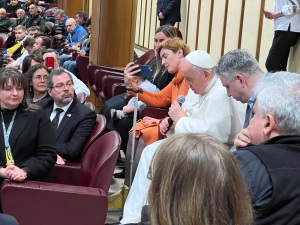Pope Francis offers a prayer for Ukraine after a screening of 'Freedom on Fire.' To his left is director Evgeny Afineevsky.