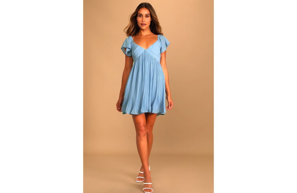 woman in a light blue flowy mini dress