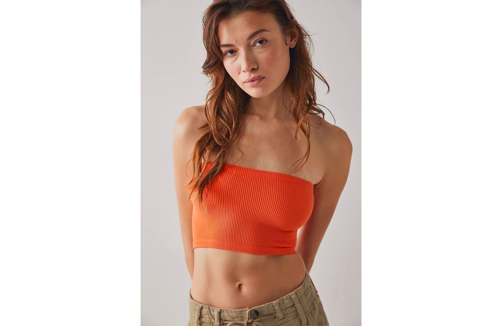 girl wearing an orange bandeau top