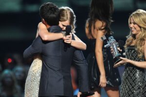 Taylor Swift accepts an award from actor Taylor Lautner and singer Shakira onstage during the 2009 MTV Video Music Awards at Radio City Music Hall on September 13, 2009 in New York City.