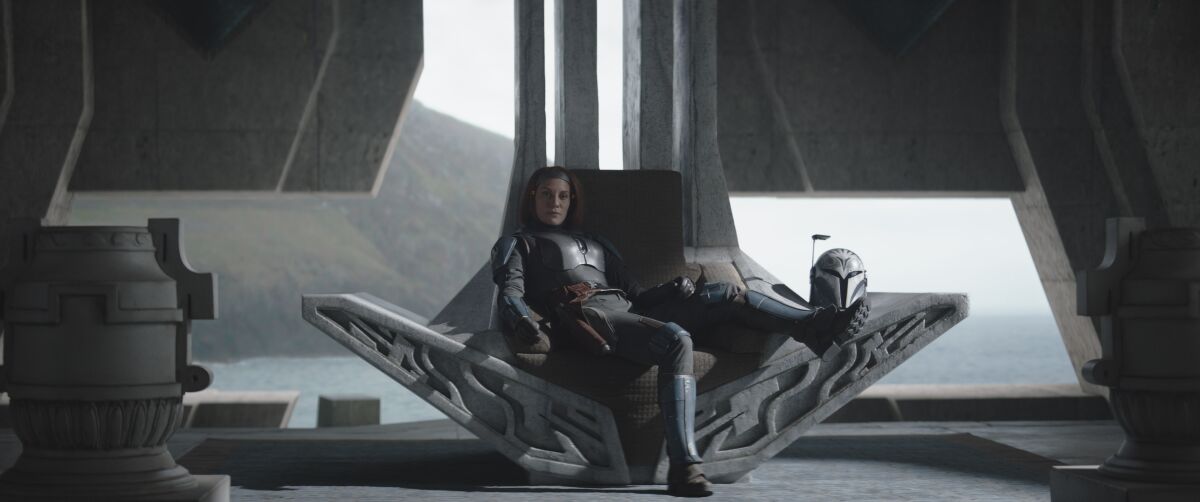 a warrior woman lounging on a throne