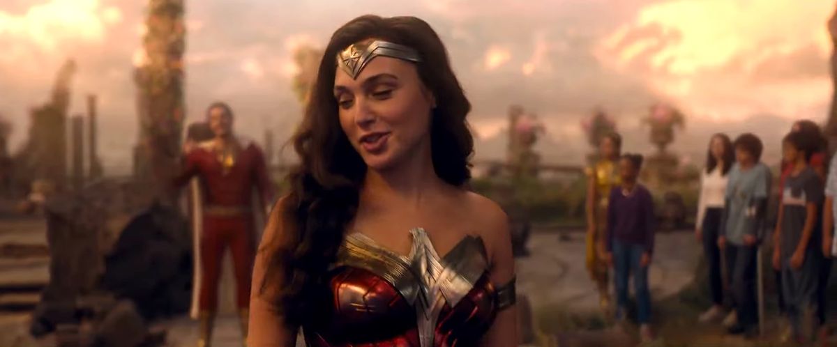 Gal Gadot as Wonder Woman walks away from Shazam and flips her hair in Fury of the Gods