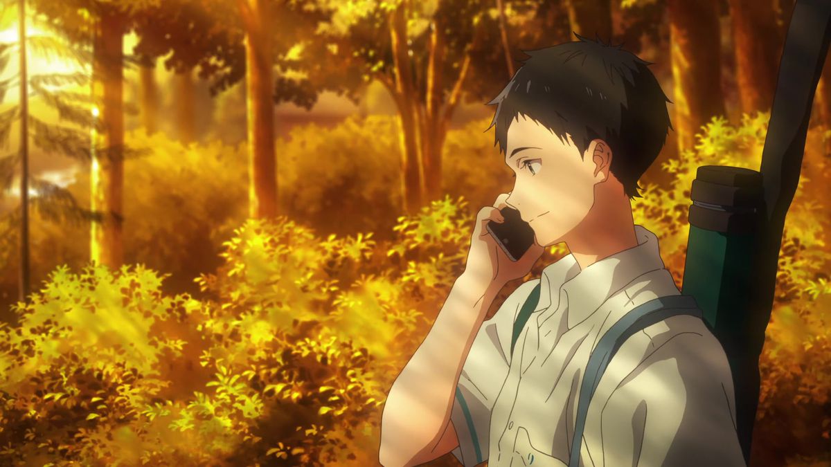 An dark-haired anime boy (Minato Narumiya) talks on a cellphone and smiles as they walk beside a forest of trees and bushes awash in late afternoon sunlight.