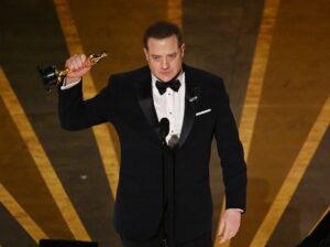 TOPSHOT - US actor Brendan Fraser accepts the Oscar for Best Actor in a Leading Role for