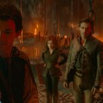 LtR: Justice Smith plays Simon, Sophia Lillis plays Doric, Michelle Rodriguez plays Holga and Chris Pine plays Edgin in Dungeons &amp; Dragons: Honor Among Thieves. Simon holds up a glowing wand as the others look on, in a rocky, lava-filled cave.