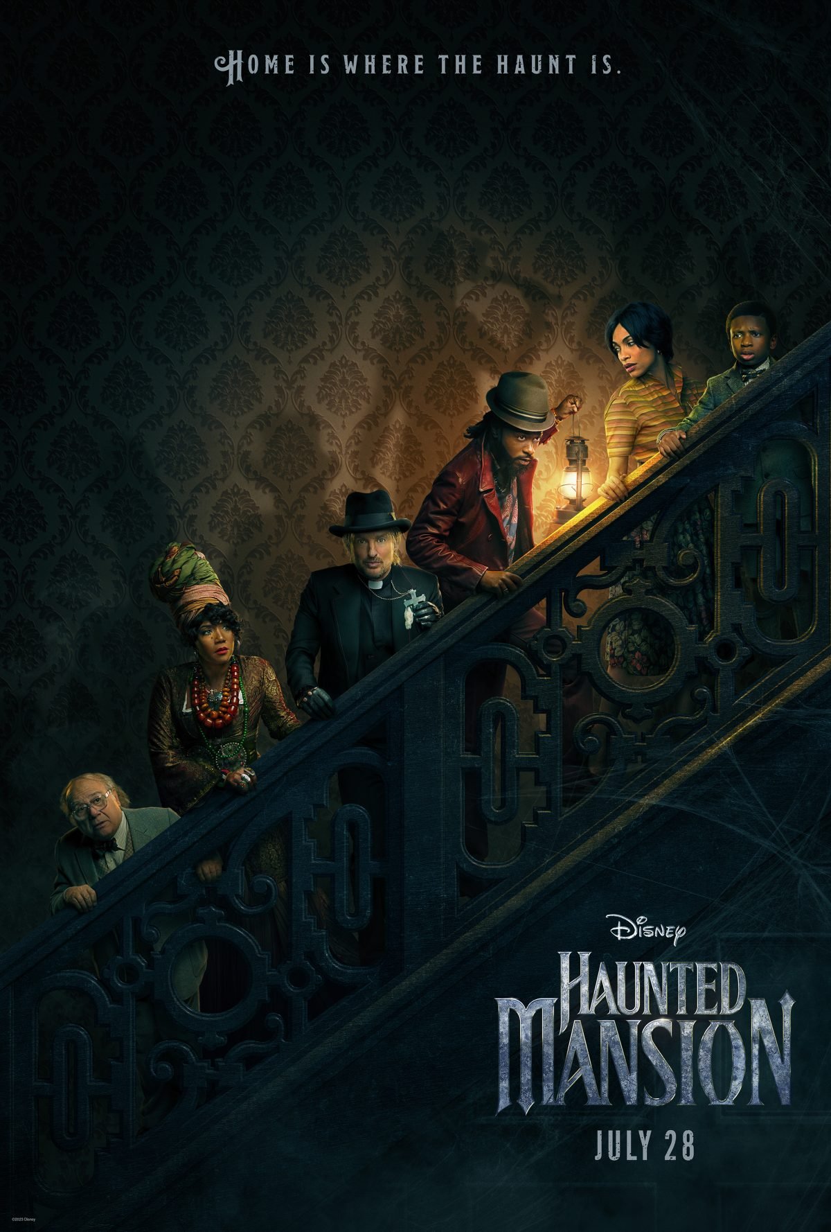 The cast of the Haunted Mansion movie lines up on the steps in a dark and creepy poster
