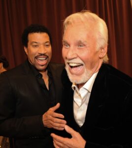 Lionel Richie (left)  revealed that the duo was halfway through writing the song when Rogers (Right) decided to change his mind ... or tune.