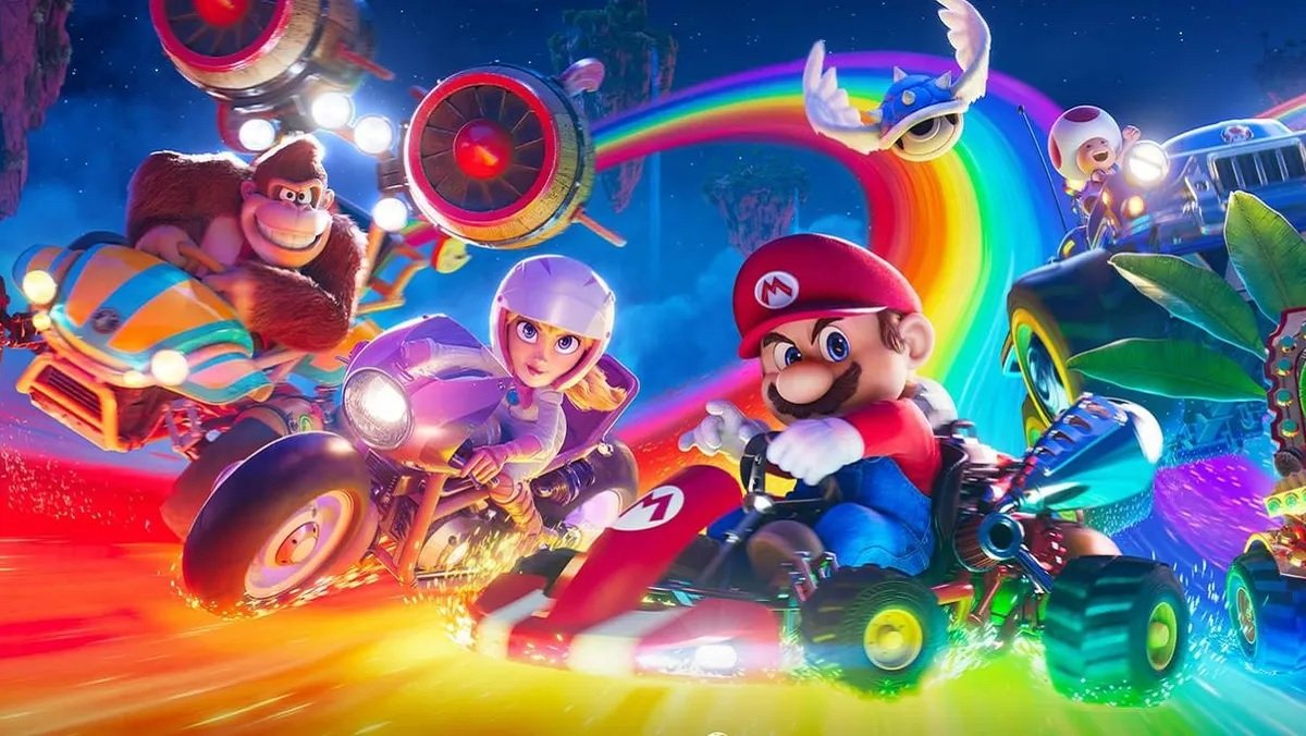 Donkey Kong, Peach, Mario, and Toad in their respective Karts on Rainbow Road in The Super Mario Bros. movie.