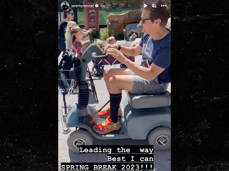 jeremy renner on scooter at six flag