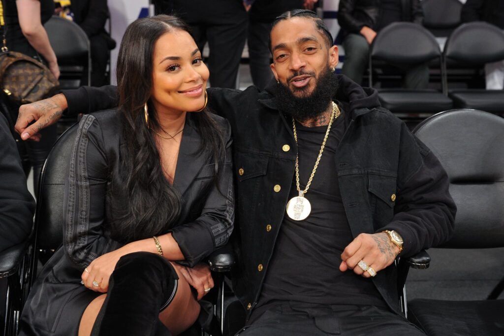 LOS ANGELES, CALIFORNIA - NOVEMBER 14: Nipsey Hussle and Lauren London attend a basketball game between the Los Angeles Lakers and the Portland Trail Blazers  at Staples Center on November 14, 2018 in Los Angeles, California. (Photo by Allen Berezovsky/Getty Images)