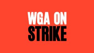 White and black text on a red background reading WGA on strike