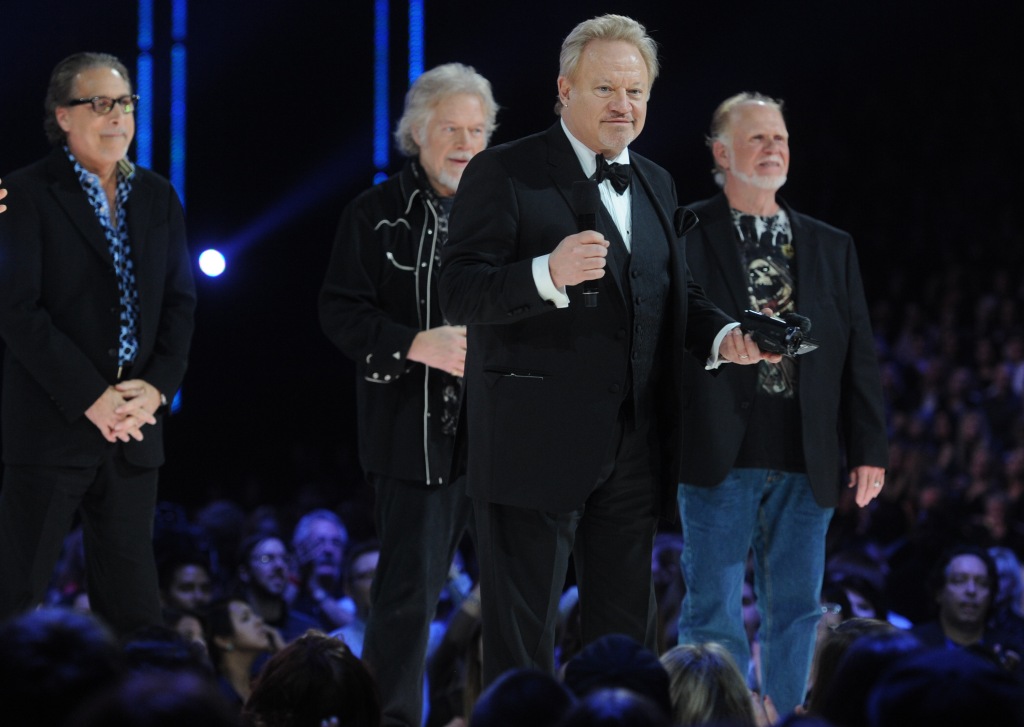 Robbie Bachman with Blair Thornton, Randy Bachman and Fred Turner as they receive their award at the 2014 Juno Awards held at the MTS Centre on March 30, 2014 in Winnipeg, Canada.  