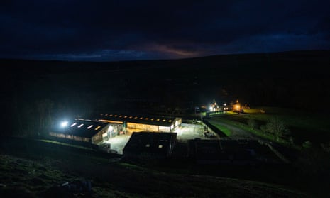 The Singer’s house, farm and lambing shed are seen among the dark skies.