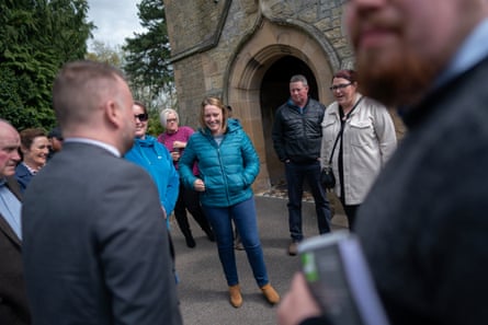 A relieved Katherine Singer and other residents are seen outside Northumberland national park offices after National Park members decided to register “no objection” to the application for mains electricity.