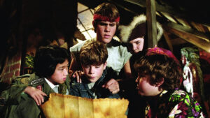 The Goonies examine a map